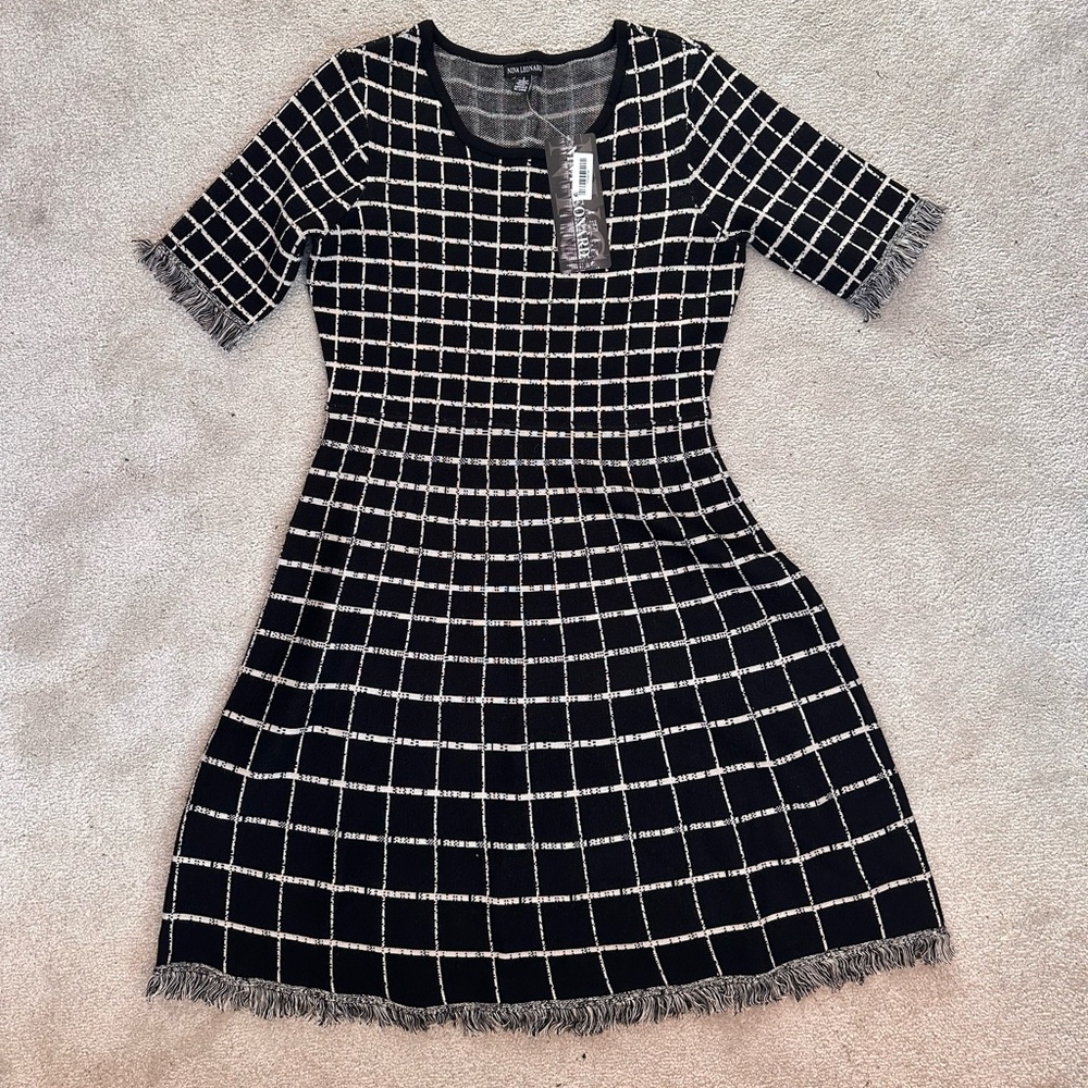 Nina Leonard, black and white patterned dress